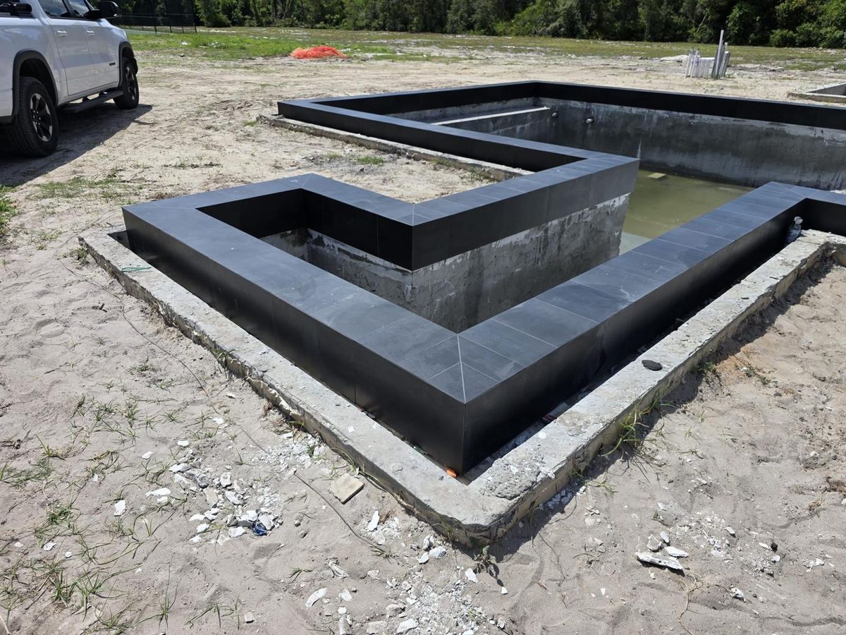 Luxury Dark Porcelain Pool & Spa - Photo 5 - Pool Remodeling in Orlando, FL