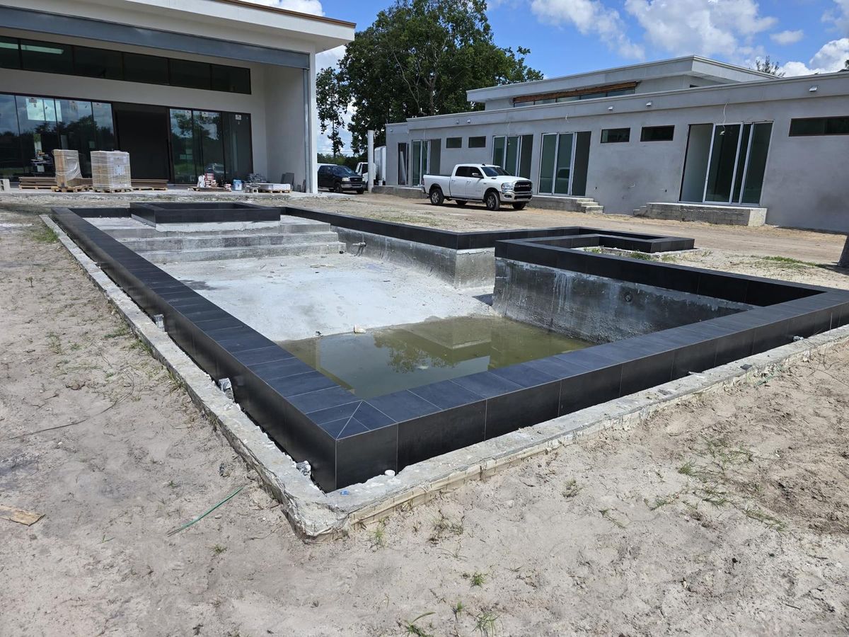 Luxury Dark Porcelain Pool & Spa - Photo 7 - Pool Remodeling in Orlando, FL