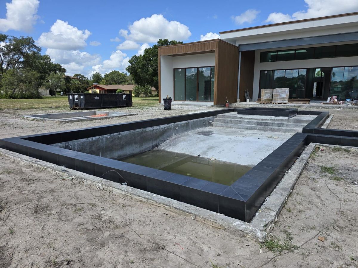 Luxury Dark Porcelain Pool & Spa - Photo 8 - Pool Remodeling in Orlando, FL