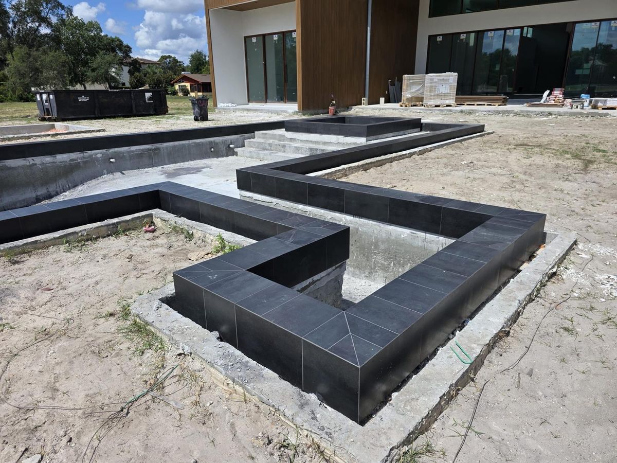 Luxury Dark Porcelain Pool & Spa - Photo 6 - Pool Remodeling in Orlando, FL